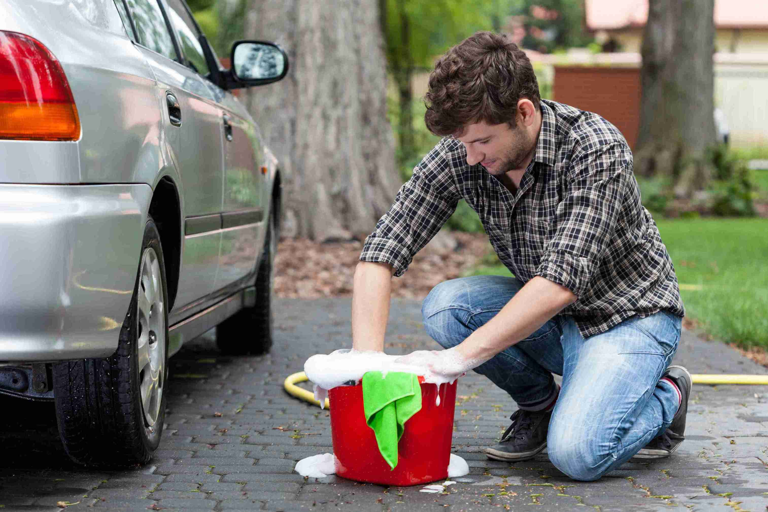 Man washes a car