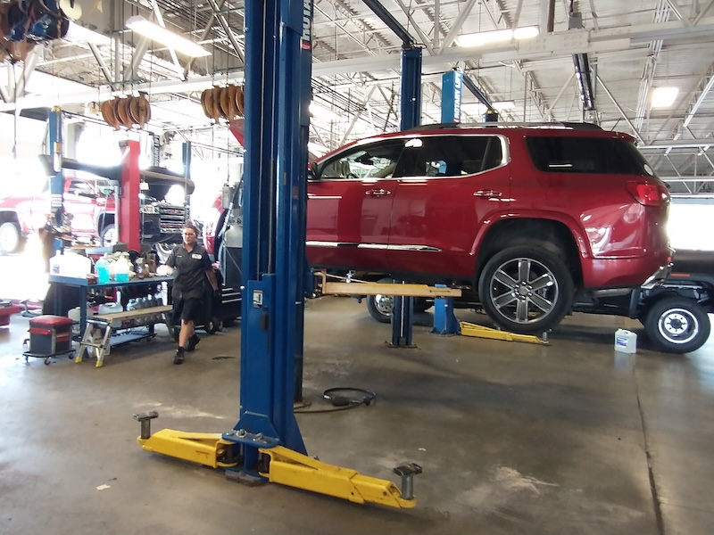 Red SUV in service bay at McLarty Daniel Buick GMC
