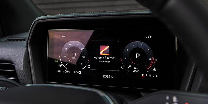 Digital dashboard showing speed, RPM, and music display